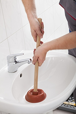 person using plunger