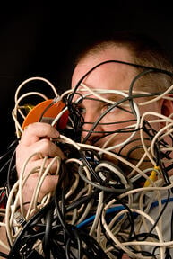 man tangled in wires