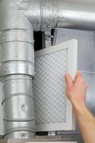 person_changing_furnace_filter