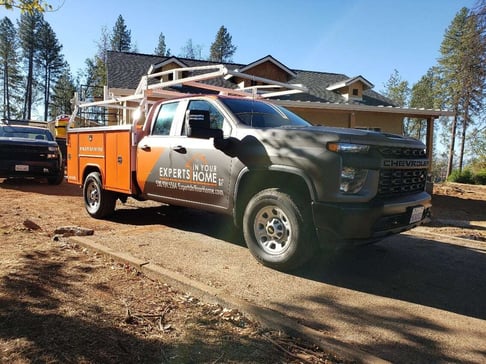 Experts In Your Home truck in front of Paradise new build.