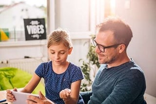 father teaching daughter about electrical safety