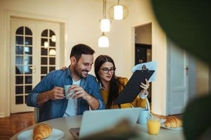 couple looking at to do list