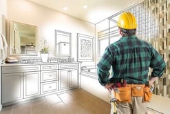 contractor looking at bathroom remodel plans