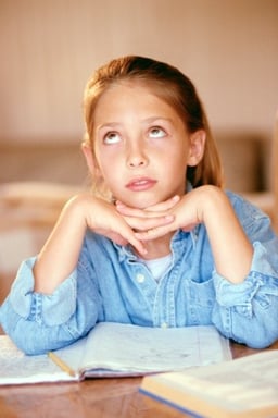 girl_looking_bored_doing_homework