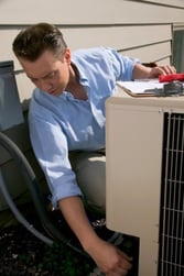 man_inspecting_HVAC_unit