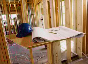 hard hat and blueprints