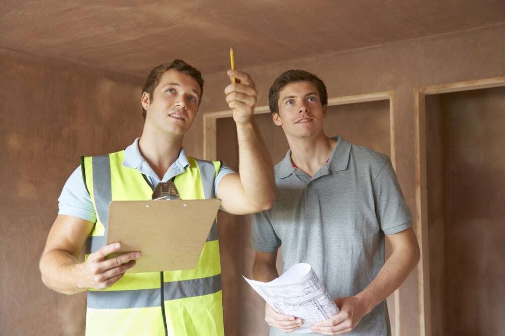 builder and inspector looking at new property