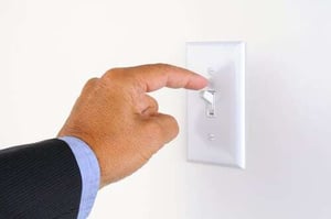 hand flicking light switch