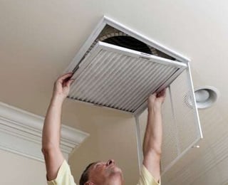 man_changing_furnace_filter