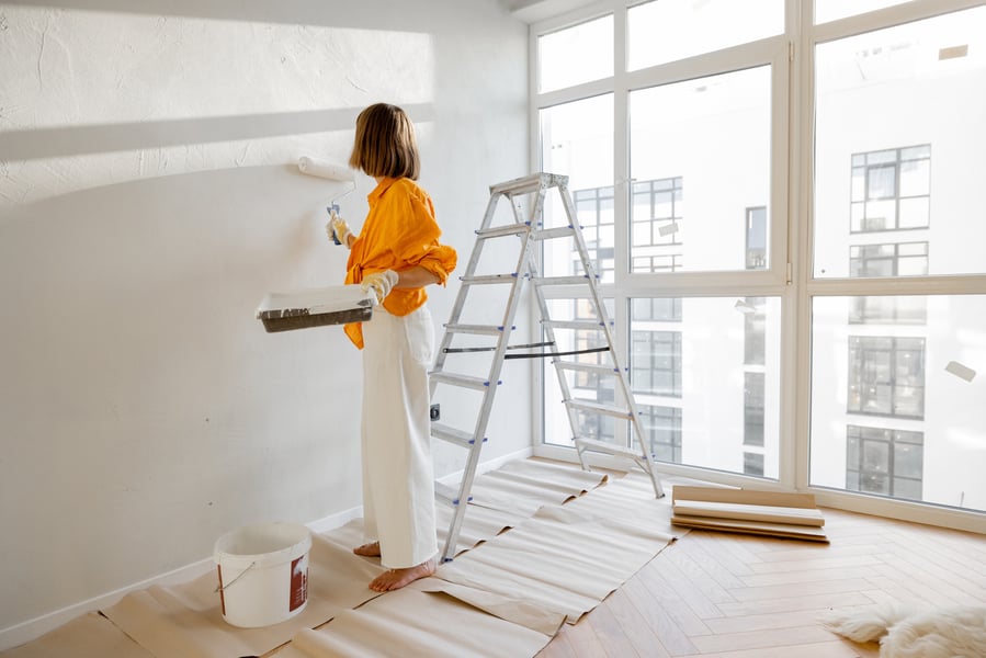 Person working on interior painting of their home