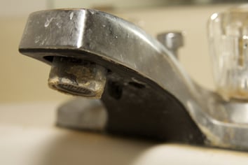 hard water stained faucet