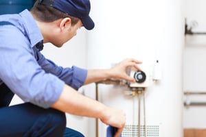 plumber fixing water heater