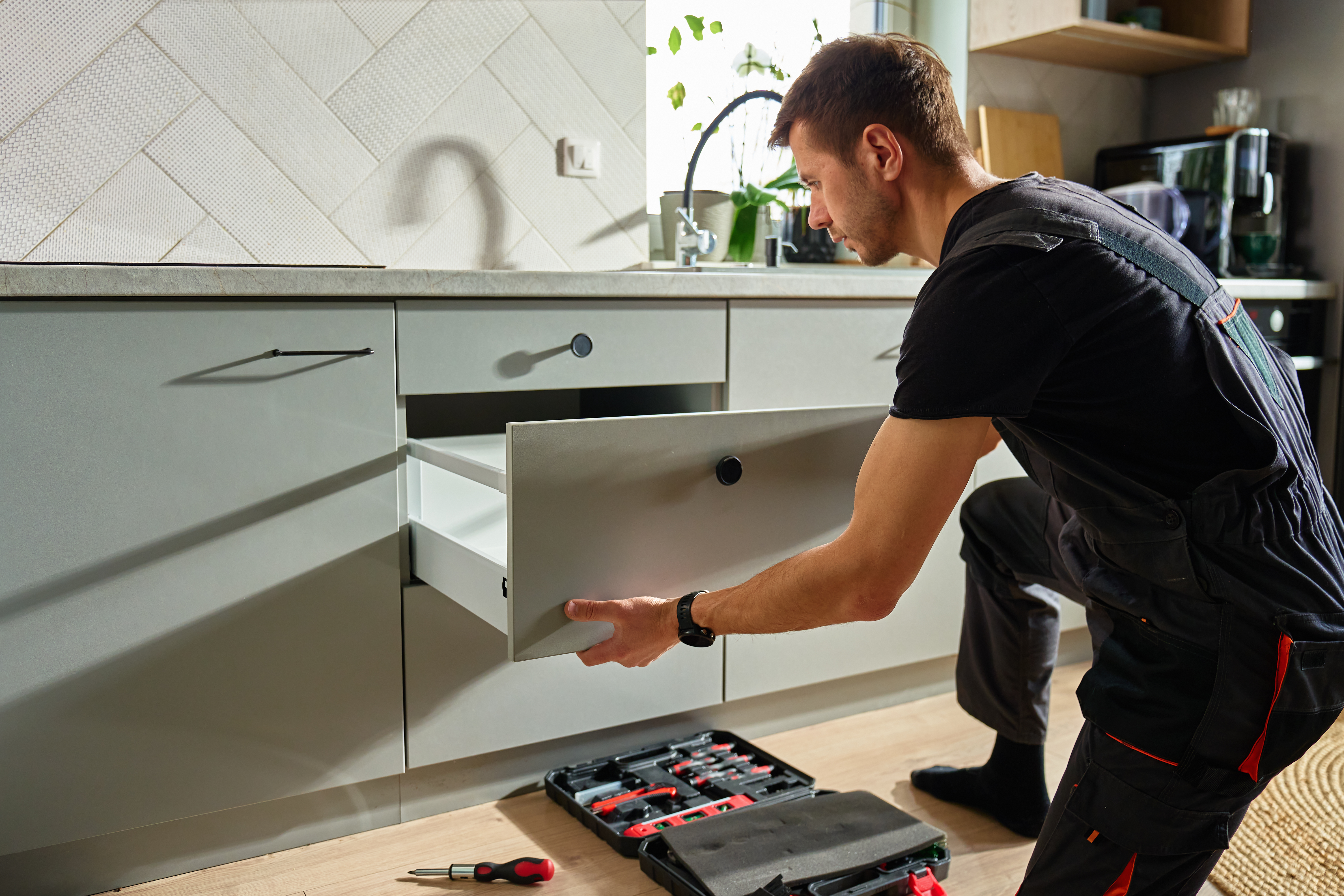 Home expert fixing a drawer to represent Refresh or Remodel? How to Choose the Right Update for Your Chico Home